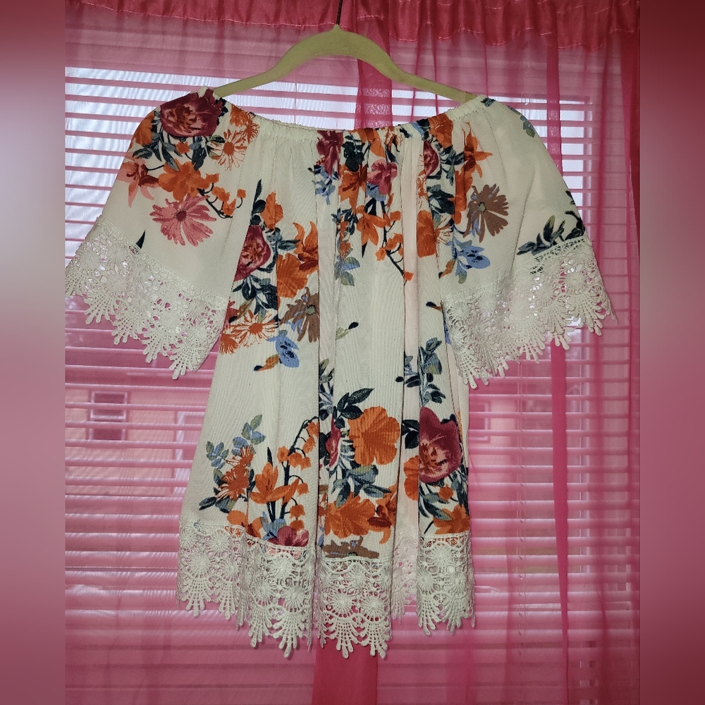 Elegant Flower Blouse, lace design on sleeves and bottom.  Brand new